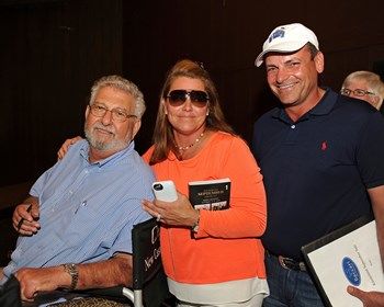 Buyer J. J. Crupi, left, with Samantha and Chris Baccari. Buyer J. J. Crupi, left, with Samantha and Chris Baccari.