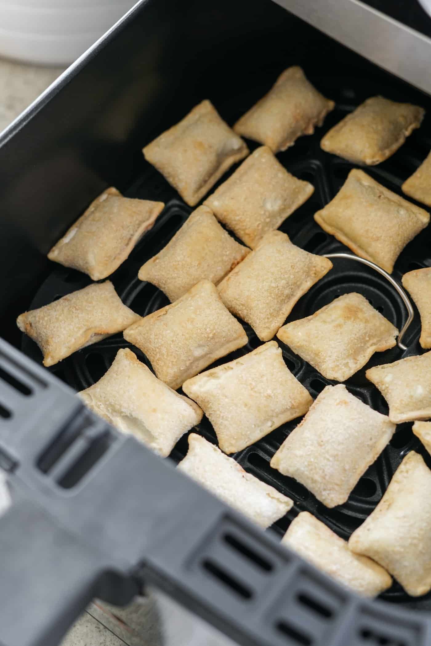 air fryer pizza rolls recipe Frozen pizza rolls in the basket of an air fryer
