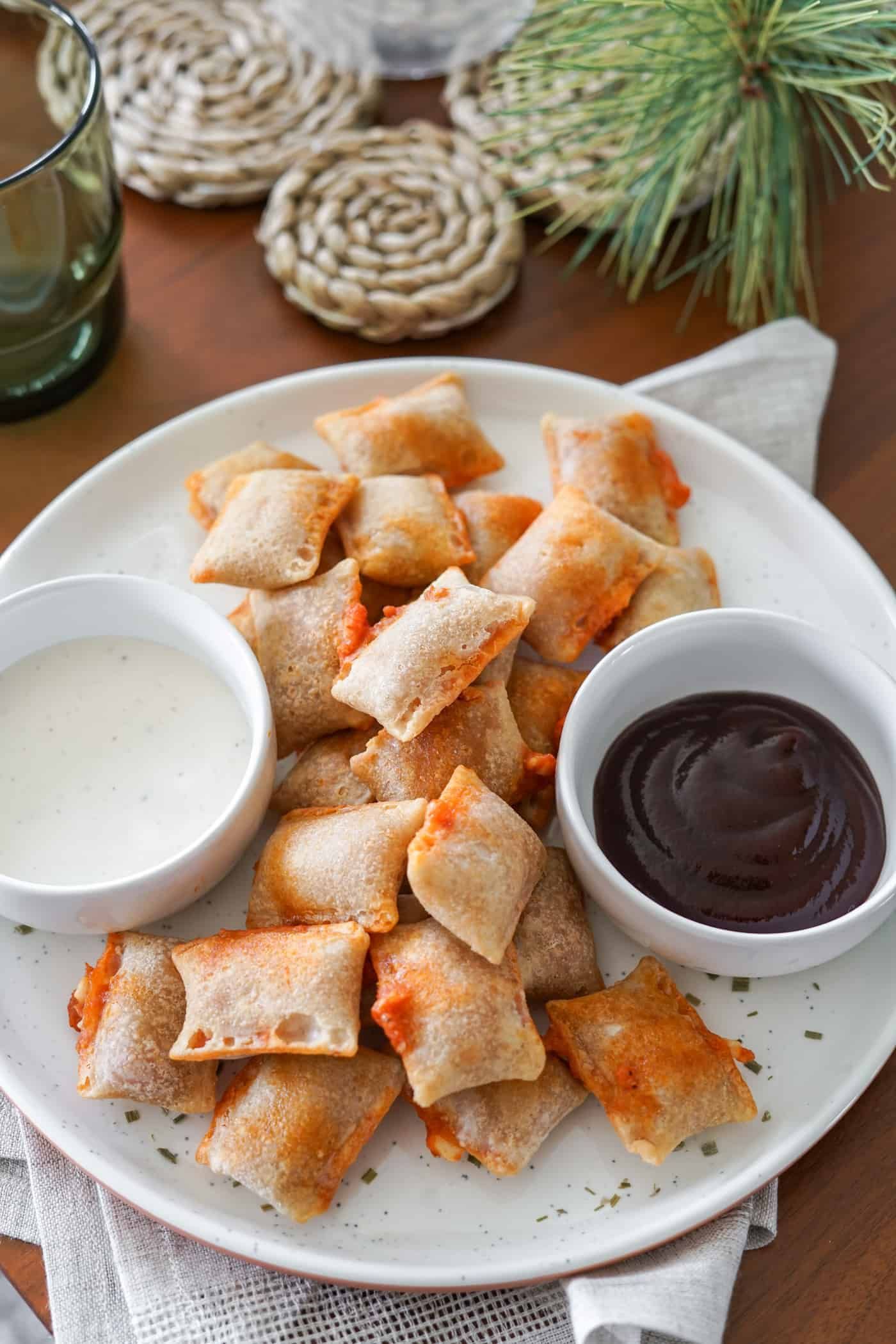 Frozen pizza rolls in air fryer A plate of air fryer pizza rolls with ranch dipping sauce