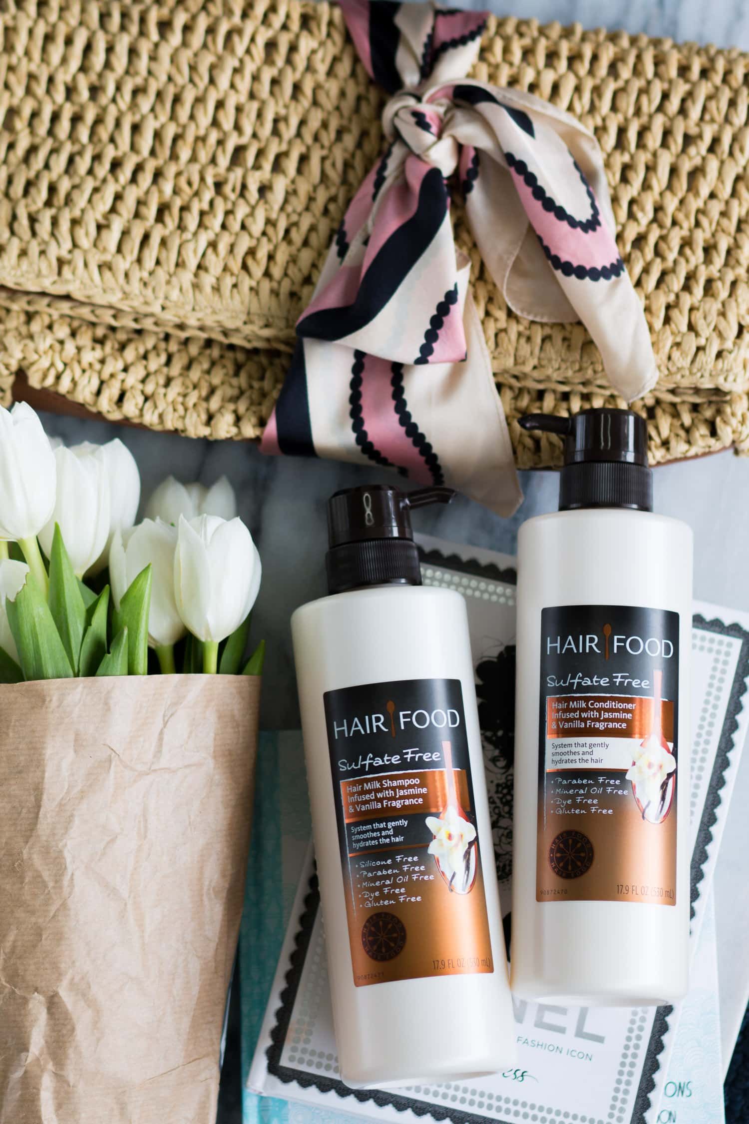Moisturizing hair care favorites | Hair Food Hair Milk Sulfate-Free Shampoo and Conditioner Review | Why you should use sulfate-free hair products | Cute straw clutch with pink, navy, and cream scarf and white tulips | Affordable drugstore hair care favorites | Best of drugstore beauty | Beauty blogger Ashley Brooke Nicholas
