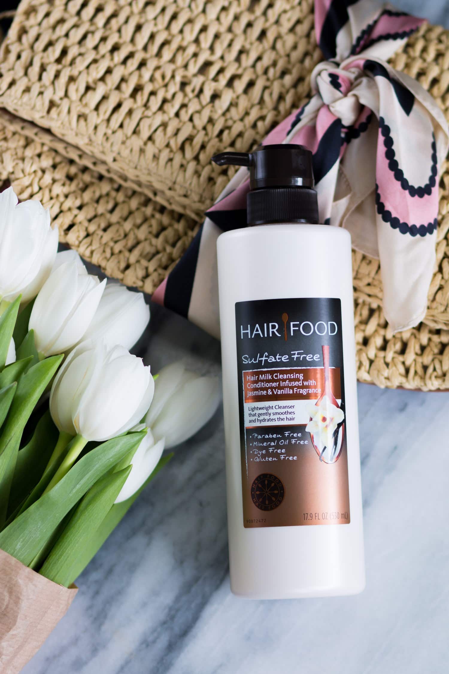 Moisturizing hair care favorites | Hair Food Hair Milk Sulfate-Free Cleansing Conditioner Review | Why you should use sulfate-free hair products | Cute straw clutch with navy, pink, and cream scarf and white tulips | Affordable drugstore hair care favorites | Best of drugstore beauty | Beauty blogger Ashley Brooke Nicholas