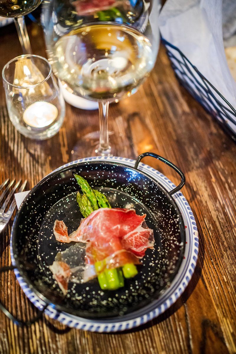 Steamed Asparagus Wrapped in Cinco Jotas Jamon Imberico de Bellota - Fun at the Williamsburg Taste Festival featured by popular DC travel blogger, Alicia Tenise
