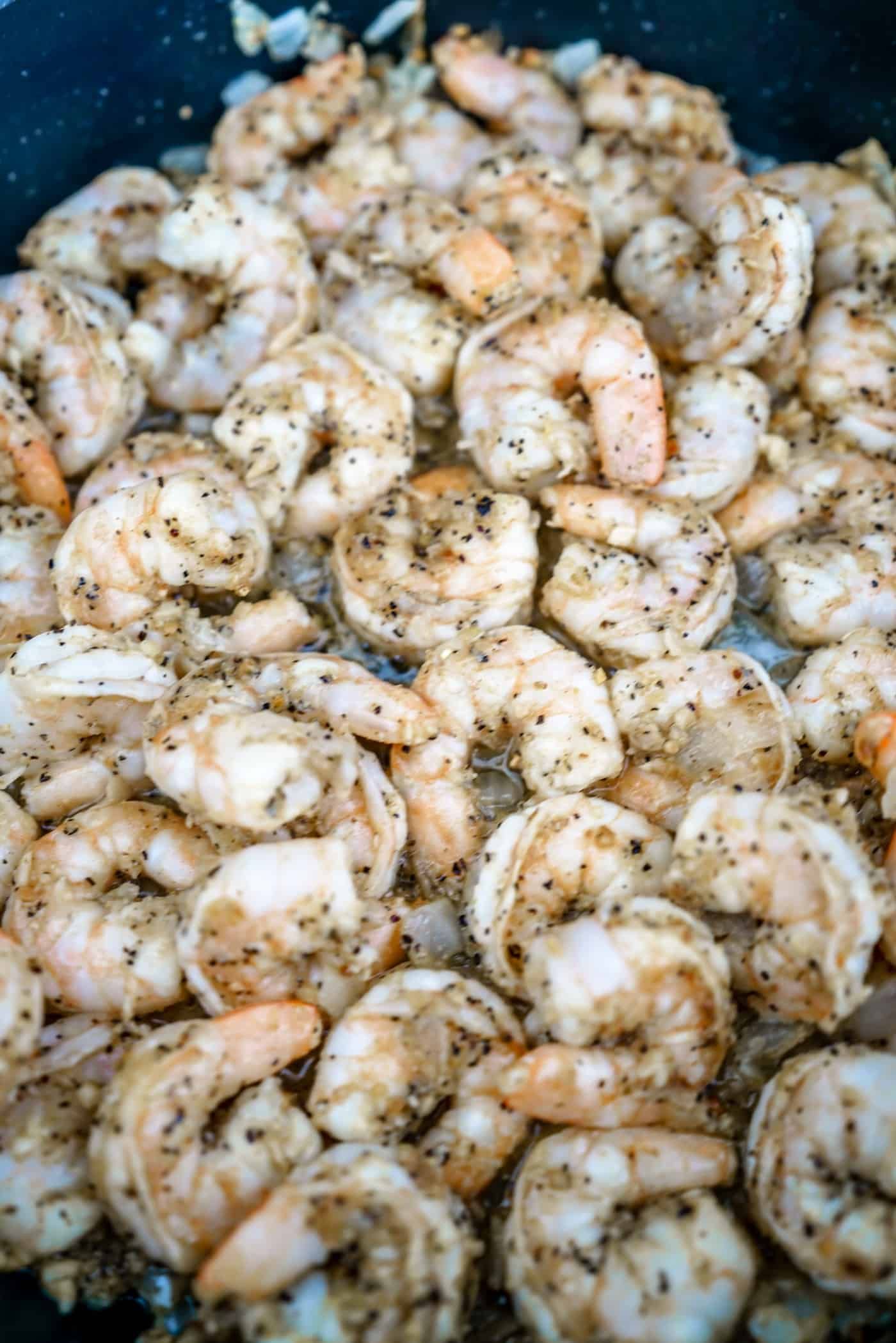 Lemon Pepper shrimp cooling in a large skillet