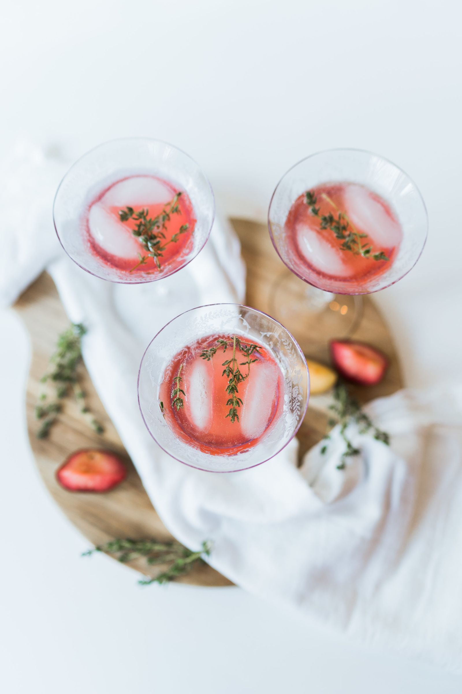 Muddled plum and fresh thyme cocktail