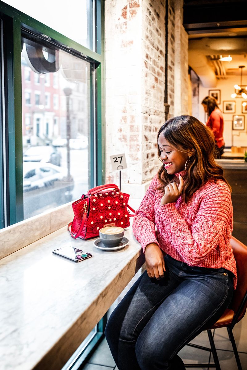 Casual Valentine's Day Outfit featured by top US fashion blogger Alicia Tenise; Image of woman wearing C/MEO Collective sweater, Madewell jeans, Zac Zac Posen bag, Kendra Scott earrings and Charlotte Tilbury 'The Queen' lipstick.