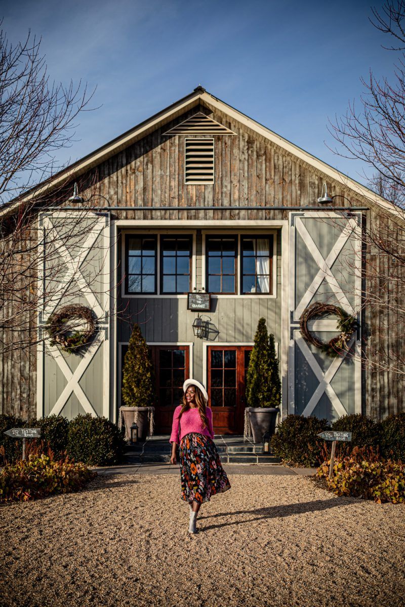 Top Things to Do in Charlottesville VA: a Complete Travel Guide by popular DC travel blogger, Alicia Tenise | Things to Do in Charlottesville VA in the Winter by popular DC travel blogger, Alicia Tenise: image of a woman at Pippin Hill Vineyards.