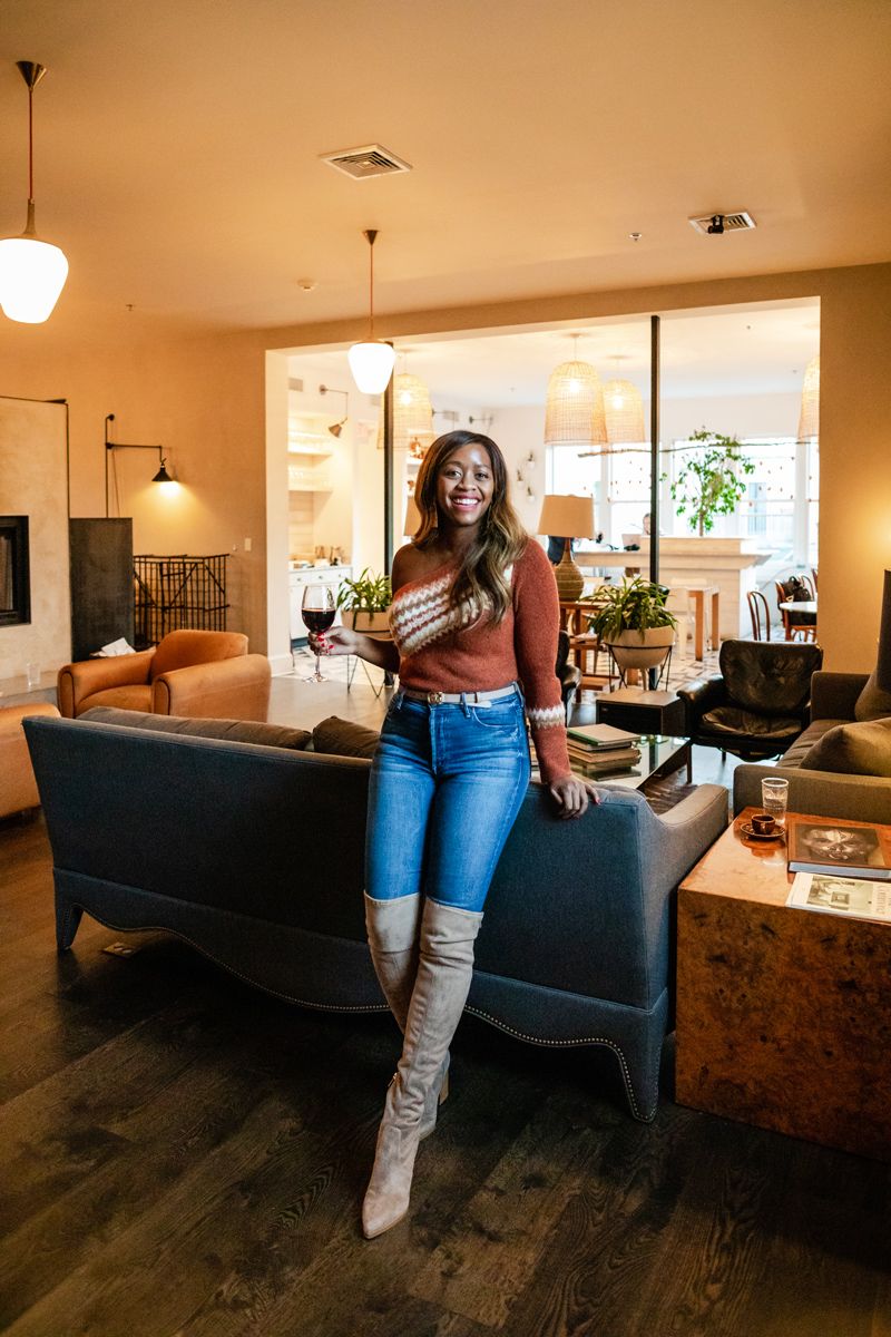 Top Things to Do in Charlottesville VA: a Complete Travel Guide by popular DC travel blogger, Alicia Tenise | Things to Do in Charlottesville VA in the Winter by popular DC travel blogger, Alicia Tenise: image of a woman standing inside Common House in Charlottesville Va.
