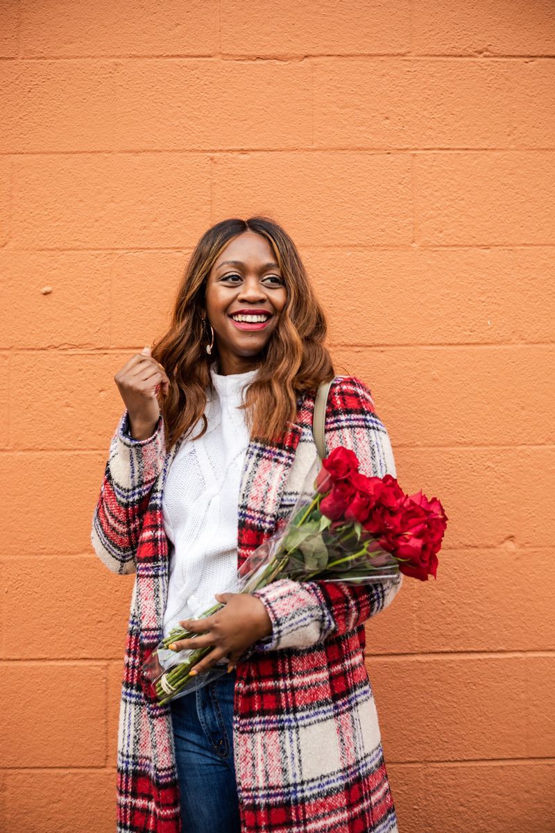 Casual Winter Uniform featured by top US fashion blogger Alicia Tenise; Image of woman wearing NVLT plaid coat, Everlane sweater, Mother jeans, Zac Zac Posen bag, Kendra Scott earrings and Laura Mercier lipstick.