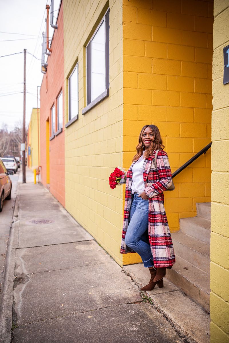 Casual Winter Uniform featured by top US fashion blogger Alicia Tenise; Image of woman wearing NVLT plaid coat, Everlane sweater, Mother jeans, Zac Zac Posen bag, Kendra Scott earrings and Laura Mercier lipstick.