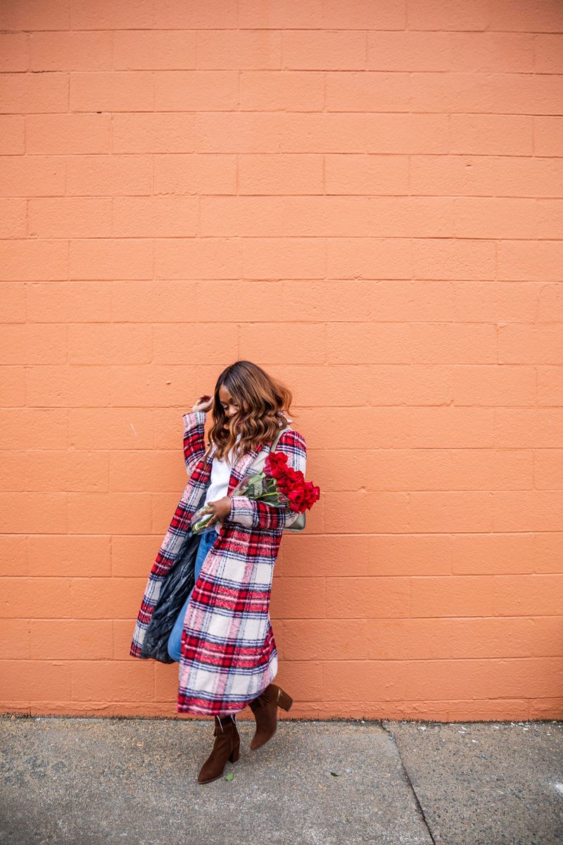 Casual Winter Uniform featured by top US fashion blogger Alicia Tenise; Image of woman wearing NVLT plaid coat, Everlane sweater, Mother jeans, Zac Zac Posen bag, Kendra Scott earrings and Laura Mercier lipstick.
