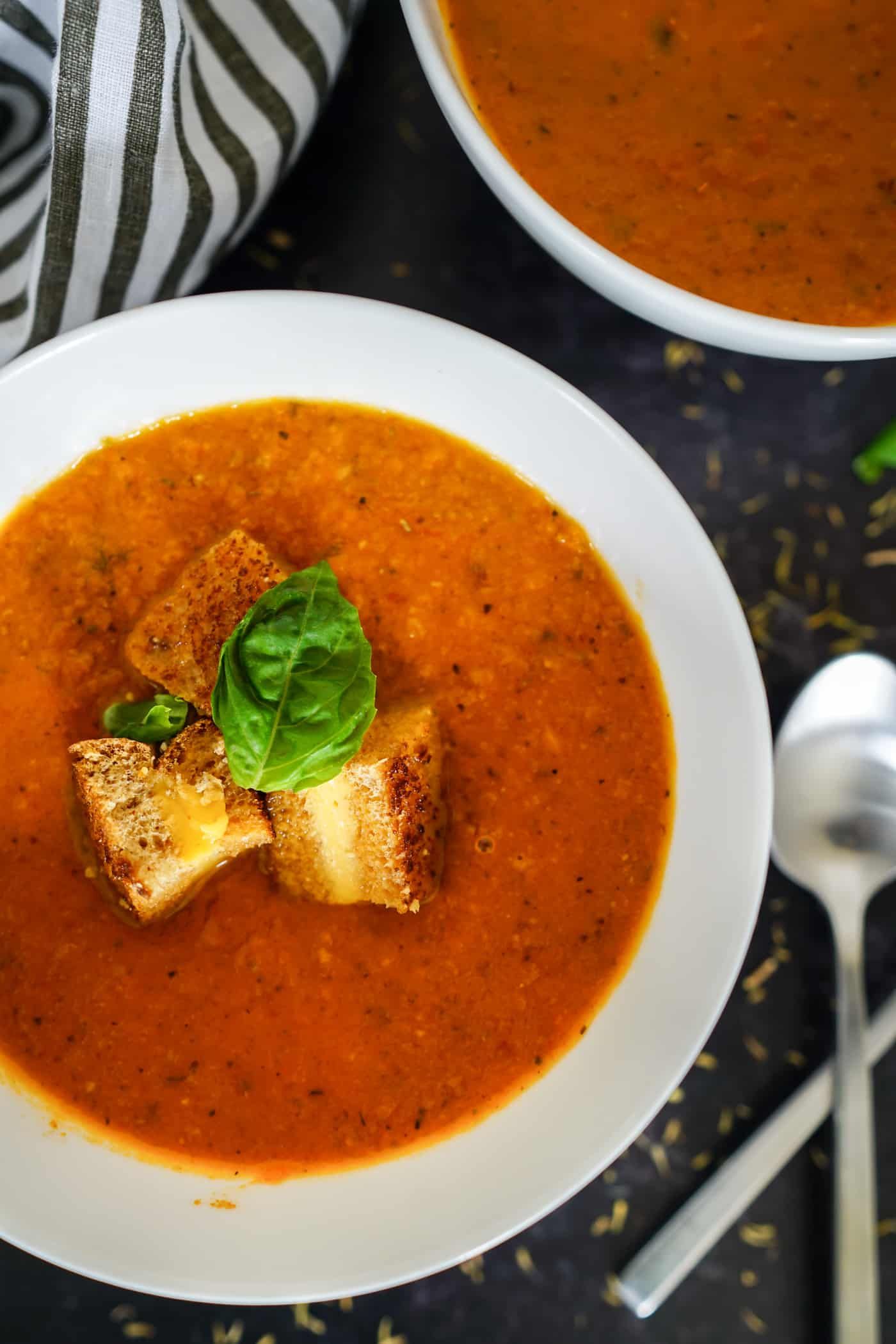 A Lily Love Affair shares a recipe for Instant Pot Tomato Basil Soup topped with grilled cheese crutons