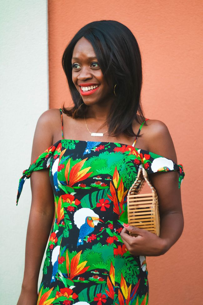 Rent the Runway Review featured by top US fashion blogger Alicia Tenise; Image of a woman wearing tropical vacation dress.