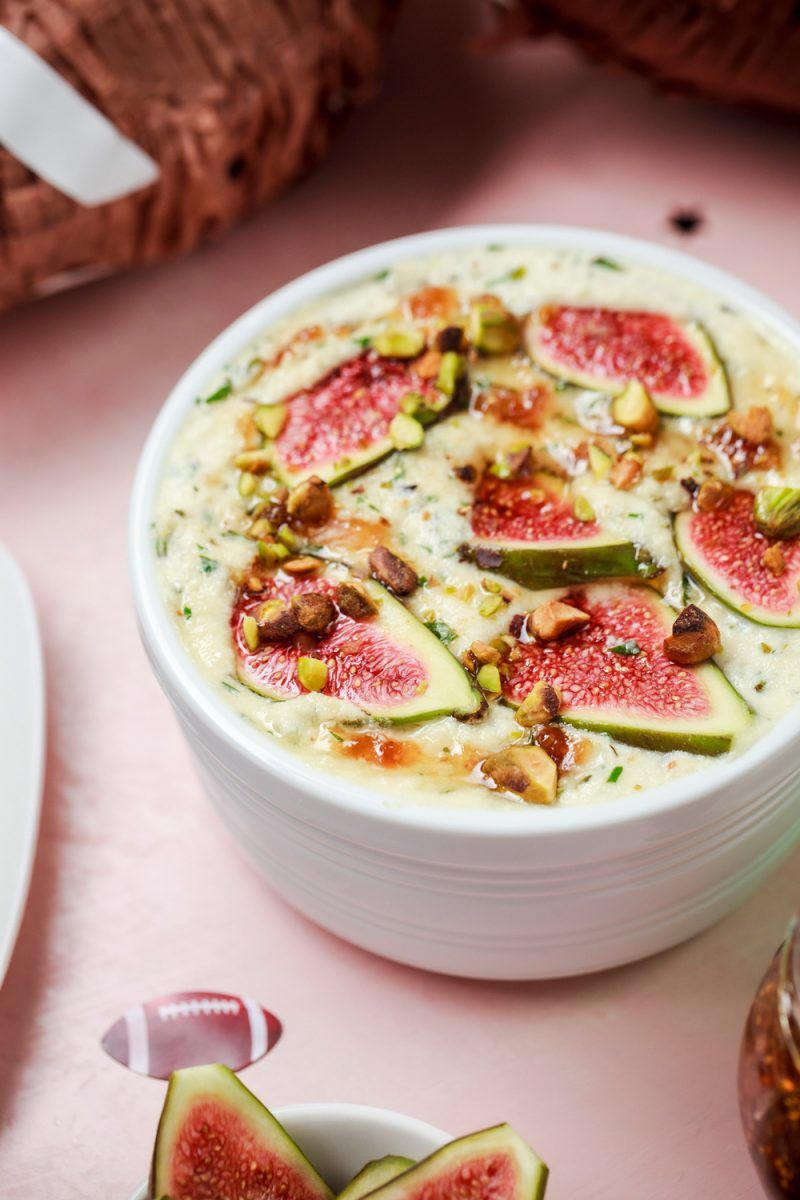 Baked Ricotta Dip w/ Figs & Pistachios |Football Party Ideas by popular D.C. lifestyle blogger, Alicia Tenise: image of baked ricotta and figs.