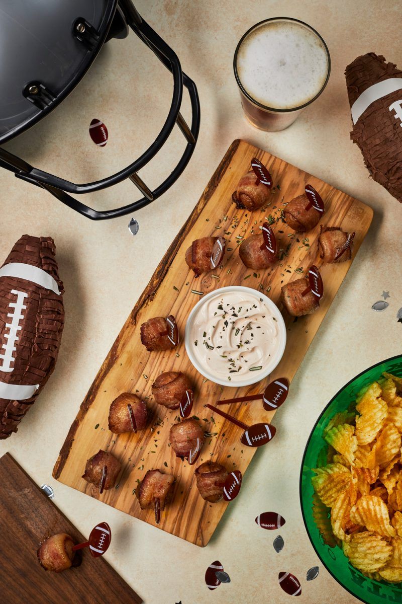 Bacon-Wrapped Potato Bites with Spicy Sour Cream Dipping Sauce |Football Party Ideas by popular D.C. lifestyle blogger, Alicia Tenise: image of bacon wrapped potato bites.
