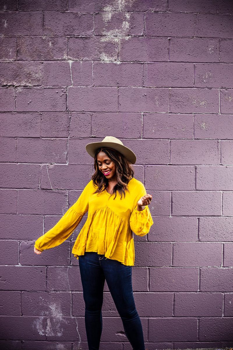 Summer to Fall Looks: Two Transitional Outfit Ideas Under $100 by popular Washington D.C. fashion blogger, Alicia Tenise: image of a woman standing in front of a purple brick wall and wearing a Walmart Time and Tru Women's Ruffle Edge Peasant Top, Walmart Time and Tru Time and Tru Women's Sculpted Jegging, and Walmart Classic Vintage Winter Wide Brim Fedora Hat 961SH Image 1 of 1 Tell us if something is incorrect Pop Fashionwear Classic Vintage Winter Wide Brim Fedora Hat.