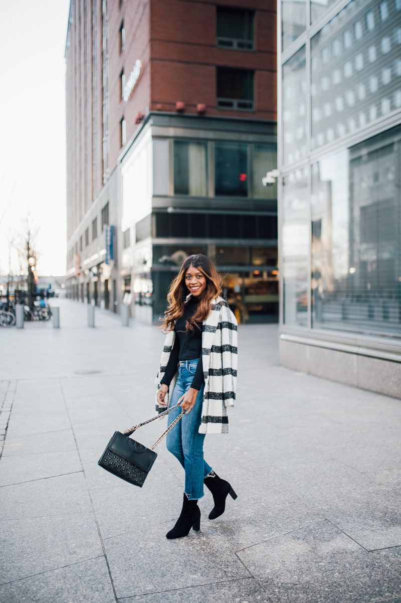 Washington DC Style Blogger wears a buffalo plaid checked coat, cropped flare denim, and sock boots