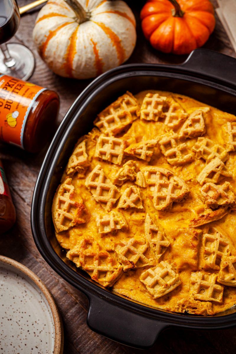 Trader Joe's Fall Recipe Idea, Pumpkin Waffle Bread Pudding | Trader Joe's Pumpkin Waffle Bread Pudding Recipe | Trader Joe's Fall Recipe Ideas | Trader Joe's Wine by popular D.C. lifestyle blogger, Alicia Tenise: image of pumpkin waffle bread pudding, mini pumpkins, cloth napkins, candle votive, and a glass of red wine.