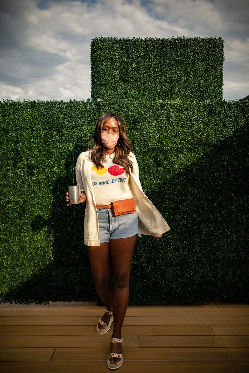 Madewell Los Angeles 1973 Graphic Lo-Fi Shrunken Tee, Madewell Leather Belt Bag | AGOLDE Jeans by popular D.C. fashion blogger, Alicia Tenise: image of Alicia Tenise wearing a Madewell Los Angeles 1973 Graphic Lo-Fi Shrunken Tee, Madewell Leather Belt Bag, and pair of Anthropologie AGOLDE Parker Ultra High-Rise Denim Shorts.