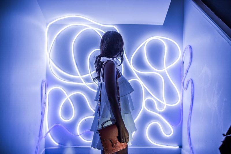 Best Things to Do in D.C. in the Spring featured by top DC blogger Alicia Tenise; Image of a woman wearing a white dress.