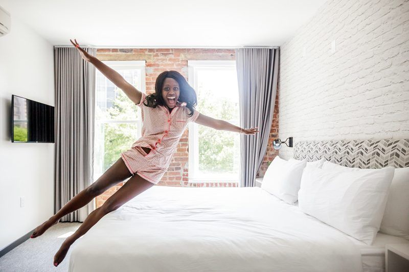 Best Things to Do in D.C. in the Spring featured by top DC blogger Alicia Tenise; Image of a woman wearing orange pajamas.