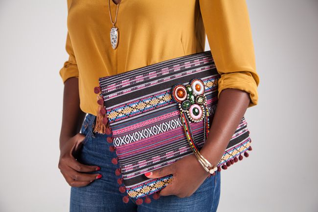 kendra scott arrowhead pendant, lou lou boutiques print clutch, mosaic district fairfax va