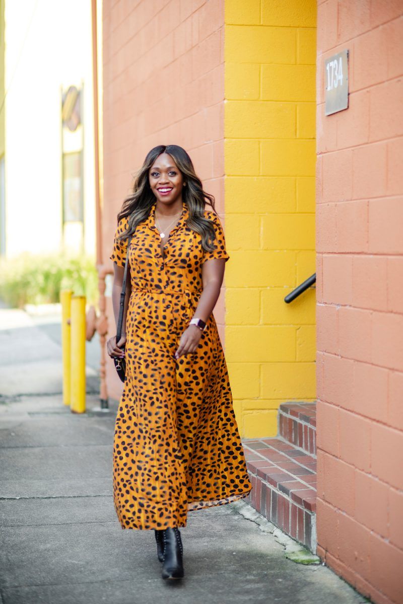 Leopard Maxi Shirtdress | Leopard Print Shirt Dress by popular D.C. fashion blogger, Alicia Tenise: image of Alicia Tenise walking outside next to a peach colored building and wearing a Anthropologie leopard print shirt dress, black point toe ankle boots and carrying a black circle purse.