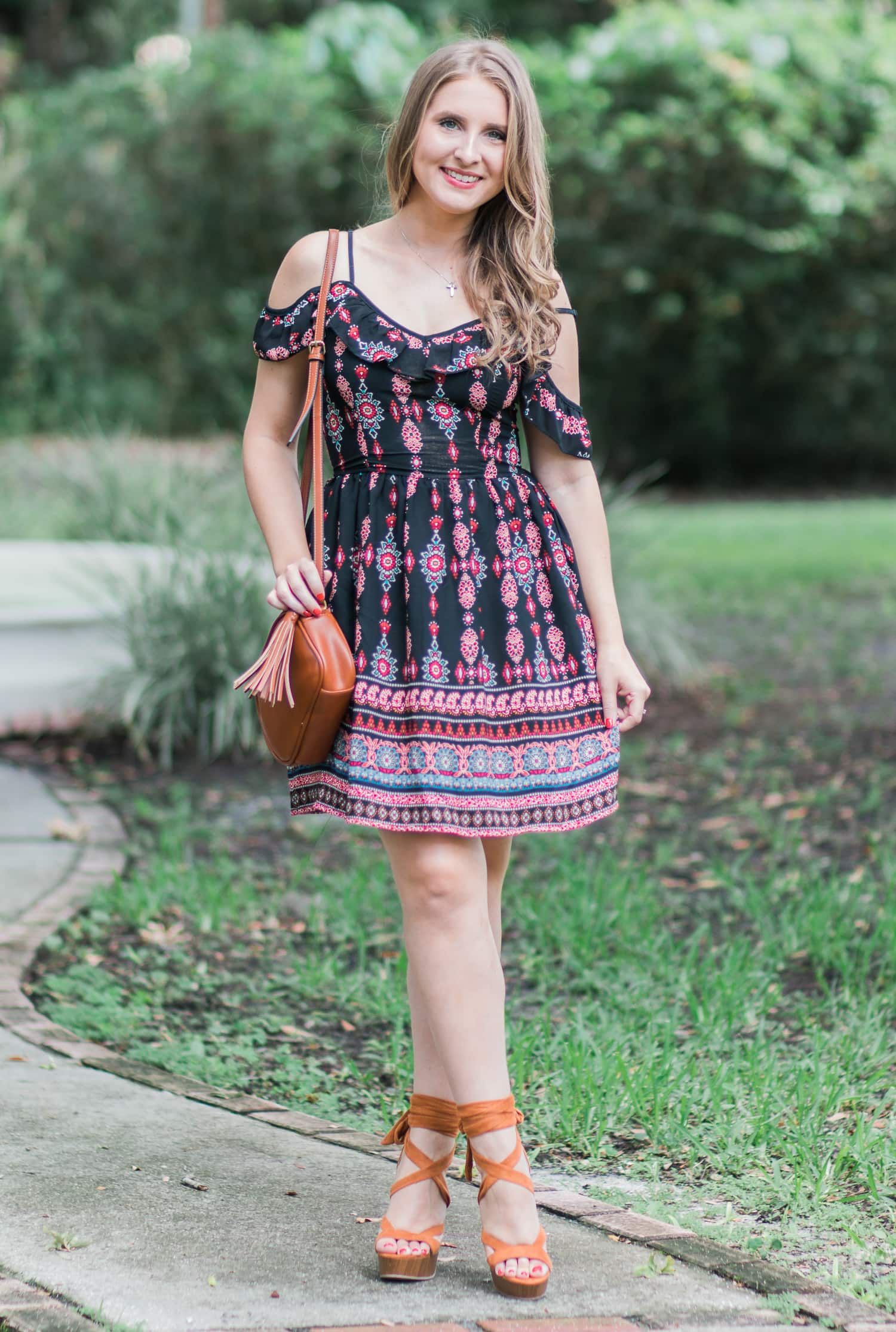 A girl can never own too many dresses- especially in the summertime! My go-to summer date night look is an off-the-shoulder sundress with cognac lace-up heels and soft curls. In addition to being a cute summer outfit idea, it's also extremely affordable. Everything in this look is under $40! Click through this pin to see the full look from Ashley Brooke Nicholas! | #MyHCLook sponsored by Hair Cuttery