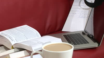 stock-footage-tracking-shot-of-laptop-cup-of-coffee-and-study-books.jpg