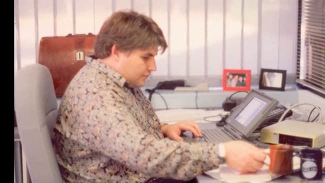Ric Richardson, then 28, uses a Macintosh PowerBook at his office at Frenchs Forest in Sydney in 1993.