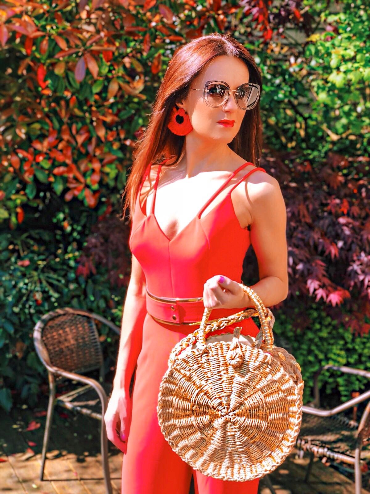 BROOKE - BRIGHT CORAL DOUBLE STRAP JUMPSUIT WITH GOLD WAISTBAND | South Beach Round Gold Woven Straw Cross Body Bag | Elegant Duchess Boutique Bohemian earrings