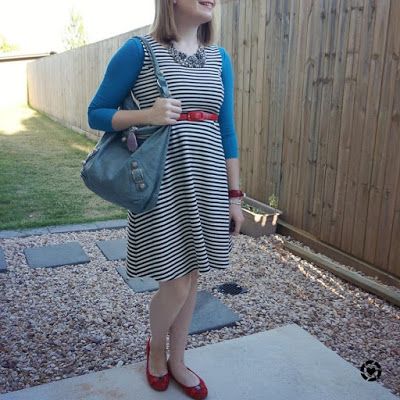 awayfromblue Instagram | teal tee under sleeveless striped fit and flare dress with Balenciaga day bag and red accessories