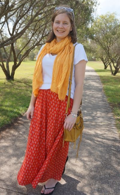 yellow and red maxi skirt outfit with white tee and micro regan bag | away from blue