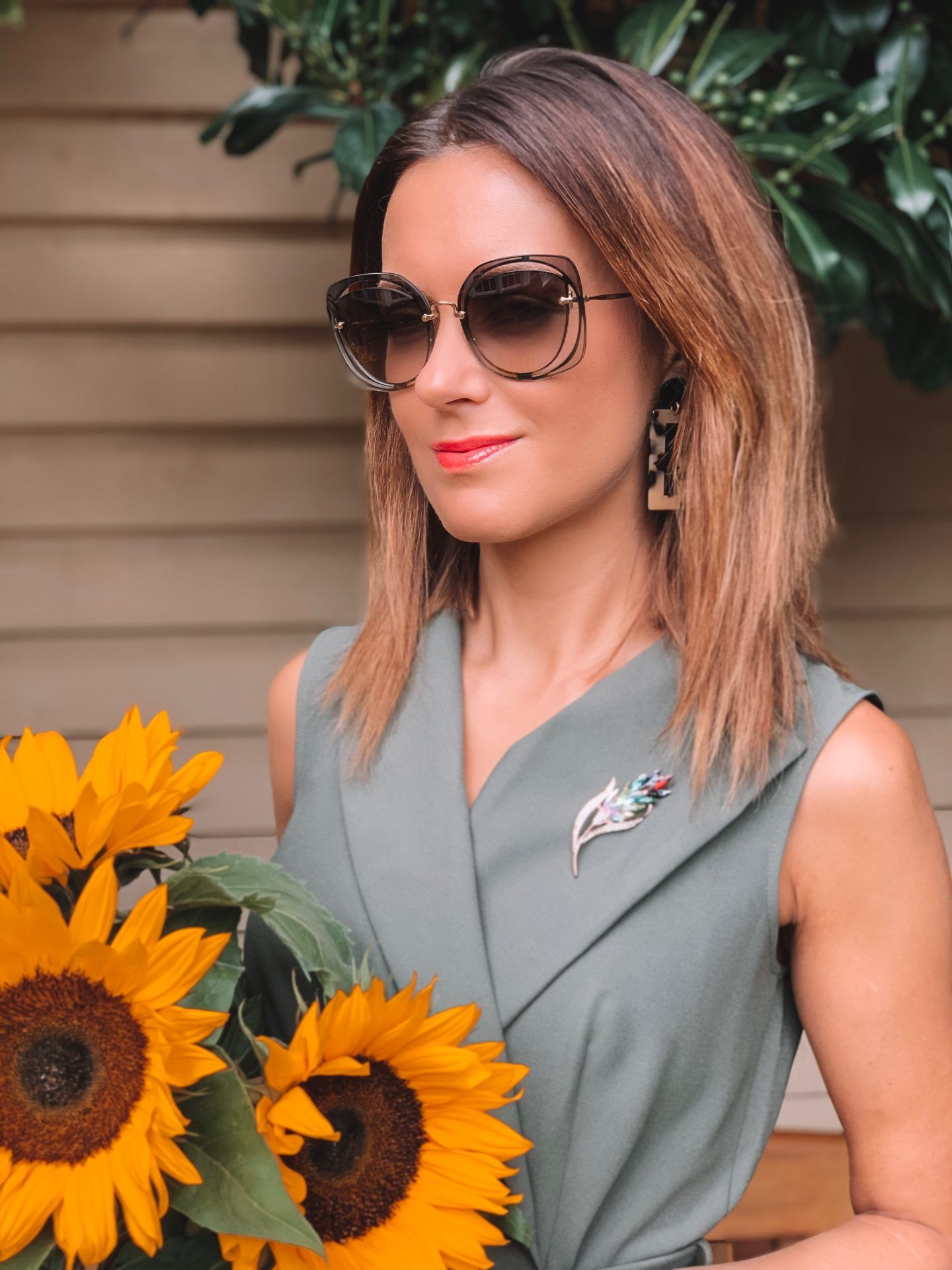 Closet London Khaki Collared Midi Pencil Dress | Elegant Duchess Boutique brooch | Miu Miu sunglasses | River Island Bag