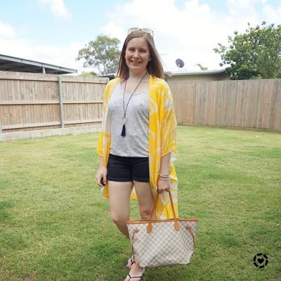 awayfromtheblue Instagram | Jeanswest Eliza summer poncho in yellow floral denim shorts tee beach picnic outfit