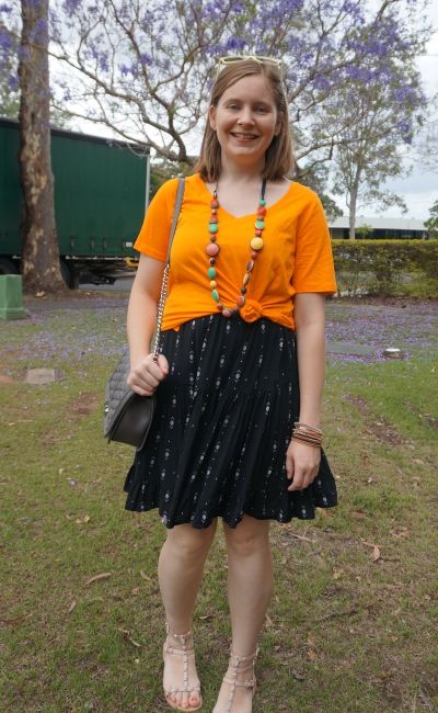 orange tee knotted over black printed tiered sundress with colourful accessories | awayfromblue