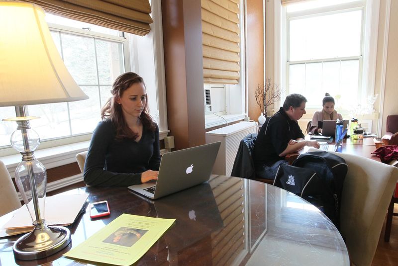 Graduate students sat in the lounge at College Hall.